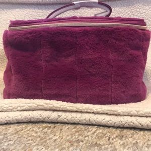 A Purple makeup bag or a small travel bag 💜💜